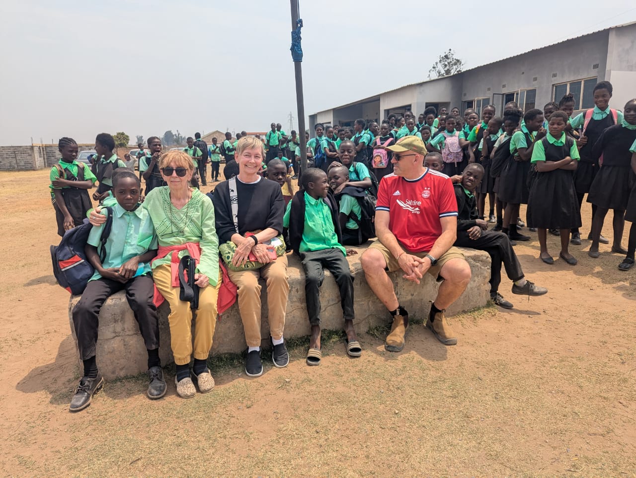Volunteers and school kids